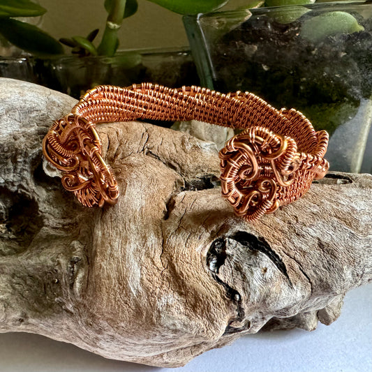 Twisting Copper Cuff bracelet created with wire wrapping techniques. Handmade by R.Kaelber